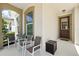 Inviting front porch with comfortable seating, perfect for relaxing and enjoying the outdoors at 1817 Caribbean View Ter, Kissimmee, FL 34747