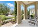 Charming front porch with classic columns offers a relaxing outdoor space and a view of the neighborhood at 1817 Caribbean View Ter, Kissimmee, FL 34747