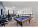 Bright game room with a pool table, seating area, and chandelier lighting at 1817 Caribbean View Ter, Kissimmee, FL 34747