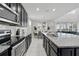Granite countertops highlight a kitchen and dining area with an open floor plan at 1817 Caribbean View Ter, Kissimmee, FL 34747