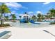 Community splash pad and pool area with waterslides and other water features for Gathering fun at 1817 Caribbean View Ter, Kissimmee, FL 34747