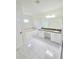Primary bath with double vanity, soaking tub, and granite countertops at 1960 Aspenridge Ct, Ocoee, FL 34761