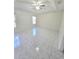 Spacious bedroom features tile floors, a ceiling fan, and bright natural light at 1960 Aspenridge Ct, Ocoee, FL 34761