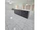 Open-concept kitchen featuring a kitchen island, pendant lighting, and dark cabinetry at 1960 Aspenridge Ct, Ocoee, FL 34761