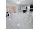 Open-concept kitchen featuring a kitchen island, pendant lighting, and tile flooring throughout at 1960 Aspenridge Ct, Ocoee, FL 34761