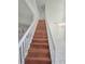 The staircase features wood treads and white risers that lead to the second floor at 1960 Aspenridge Ct, Ocoee, FL 34761