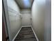 Walk-in closet providing ample storage space with wire shelving and durable flooring at 19935 Villa Isle Dr # 107, Orlando, FL 32821