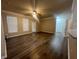 Spacious living room with wood flooring, ceiling fan and large windows at 19935 Villa Isle Dr # 107, Orlando, FL 32821