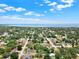 Stunning aerial view showcasing the neighborhood's proximity to the bay and lush green landscaping at 2317 10Th St, St Cloud, FL 34769