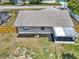 Aerial view of the home's backyard with a screened-in lanai and a new wooden fence around the perimeter at 2317 10Th St, St Cloud, FL 34769