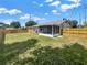 The backyard features a screened-in lanai and a new wooden fence, offering a private outdoor living space at 2317 10Th St, St Cloud, FL 34769