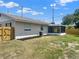 Backyard featuring an enclosed patio and well-maintained landscaping at 2317 10Th St, St Cloud, FL 34769