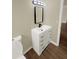 Bathroom featuring modern sink, vanity, lighting, and wood look floors at 2317 10Th St, St Cloud, FL 34769