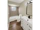 Bathroom featuring modern sink, vanity, lighting, and a shower-tub combo with stylish tile at 2317 10Th St, St Cloud, FL 34769