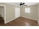 Bedroom featuring wood floors, ceiling fan, closet, and bright natural light at 2317 10Th St, St Cloud, FL 34769