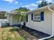 Charming single story home featuring fresh paint, decorative shutters, and a newly landscaped garden at 2317 10Th St, St Cloud, FL 34769