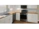 The kitchen includes updated stainless steel appliances and sleek butcher block countertops at 2317 10Th St, St Cloud, FL 34769