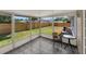 Enclosed patio perfect for outdoor seating, with tile flooring and views of the backyard at 2317 10Th St, St Cloud, FL 34769