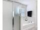 Bathroom features a tub and separate glass shower at 238 Granada Ave, Davenport, FL 33837