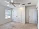 An empty bedroom with carpet flooring, a window and a ceiling fan at 238 Granada Ave, Davenport, FL 33837