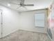 Bedroom features carpet floors, ceiling fan and artistic wallpaper at 238 Granada Ave, Davenport, FL 33837