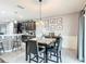 Dining area adjacent to the kitchen, featuring a table set for four and stylish decor at 238 Granada Ave, Davenport, FL 33837