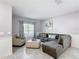 Cozy living room with comfortable seating, soft lighting, and neutral decor at 238 Granada Ave, Davenport, FL 33837