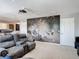 Home theater offers tiered seating, projector, and a large movie themed wall mural at 238 Granada Ave, Davenport, FL 33837