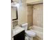 Bathroom featuring a modern vanity, toilet, and a shower and tub combo with tiled walls and updated fixtures at 2408 Barley Club Ct # 2, Orlando, FL 32837