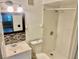 Bathroom featuring a modern vanity, toilet, and a walk-in shower with tiled walls and updated fixtures at 2408 Barley Club Ct # 2, Orlando, FL 32837