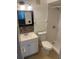 Bathroom featuring a modern vanity, toilet, and a walk-in shower with tiled walls and updated fixtures at 2408 Barley Club Ct # 2, Orlando, FL 32837