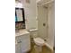Bathroom with tiled shower, modern vanity, and mosaic backsplash at 2408 Barley Club Ct # 2, Orlando, FL 32837