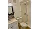 Bathroom featuring a modern vanity, toilet, and a walk-in shower with tiled walls and updated fixtures at 2408 Barley Club Ct # 2, Orlando, FL 32837