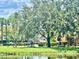 Outdoor exercise area near the pond, surrounded by greenery at 2408 Barley Club Ct # 2, Orlando, FL 32837