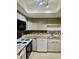 Updated kitchen features grey cabinetry and granite countertops at 2408 Barley Club Ct # 2, Orlando, FL 32837