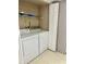 Laundry room with washer, dryer, and shelving for storage at 2408 Barley Club Ct # 2, Orlando, FL 32837