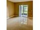 A living room with tile floors and sliding glass doors at 2408 Barley Club Ct # 2, Orlando, FL 32837