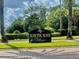Community sign for Hawthorne Village with lush landscaping at 2408 Barley Club Ct # 2, Orlando, FL 32837