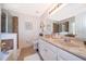 Bathroom featuring double sinks, a tile floor, and a glass-enclosed shower at 2462 Hassonite St, Kissimmee, FL 34744