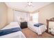 Bedroom with two twin beds, brown carpeting, and a window at 2462 Hassonite St, Kissimmee, FL 34744