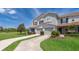 Charming townhome featuring a well-manicured lawn and a two-car garage at 2462 Hassonite St, Kissimmee, FL 34744