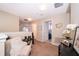 Hallway with neutral walls, brown carpeting, and an array of doorways at 2462 Hassonite St, Kissimmee, FL 34744
