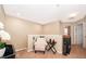 Hallway with neutral walls, brown carpeting, and an array of doorways at 2462 Hassonite St, Kissimmee, FL 34744