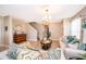 Comfortable living room featuring tile flooring, natural light, and a staircase leading to the upper level at 2462 Hassonite St, Kissimmee, FL 34744