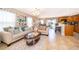 Inviting living room and eat-in kitchen with tile floors and lots of light at 2462 Hassonite St, Kissimmee, FL 34744