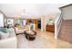 Inviting living room featuring tile floors that flow into the eat-in kitchen at 2462 Hassonite St, Kissimmee, FL 34744