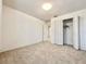 Bright bedroom featuring plush carpeting, a large closet, and neutral walls at 2511 Balmoral Dr, Kissimmee, FL 34744
