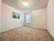 This carpeted bedroom has a bright window and a neutral color scheme at 2511 Balmoral Dr, Kissimmee, FL 34744