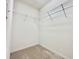 Walk-in closet with wire shelving and carpet at 2511 Balmoral Dr, Kissimmee, FL 34744