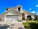 Well-maintained two-story home featuring an attached two-car garage and landscaped front yard at 2511 Balmoral Dr, Kissimmee, FL 34744